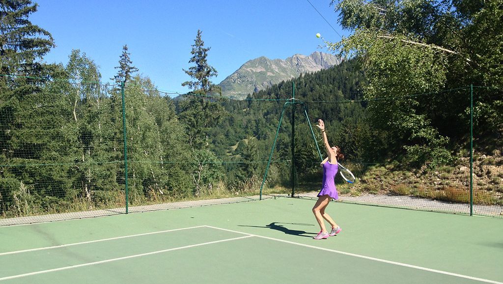 One of our guests enjoying the use of our tennis court in the summer